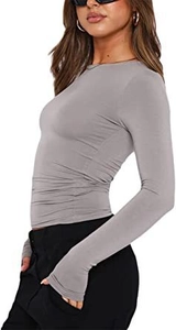 Detail of side ruching on a slim-fit dark grey long sleeve top with soft knit texture