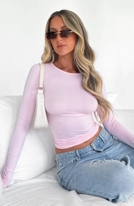 Slim fit light pink long sleeve T-shirt styled with jeans and white shoulder bag
