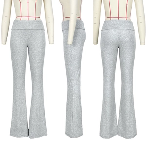 Close-up of heather grey flared yoga pants with high-waisted foldover waistband detail