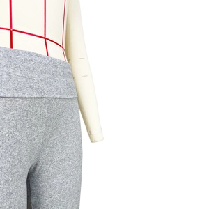 Detail of grey heather sports leggings showing wide waistband and knit texture on mannequin