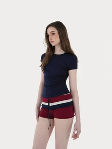 Detail of slim fit navy blue sports t-shirt and striped shorts set with drawstring