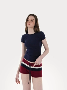 Detail of navy blue crew neck T-shirt and striped drawstring shorts for women