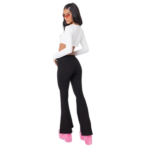Detail of high-waist flared pants with trendy fold-over waistband and slim-fit crop top
