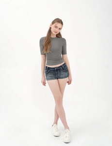 Slim fit grey knit t-shirt paired with vintage washed denim shorts for a summer street look