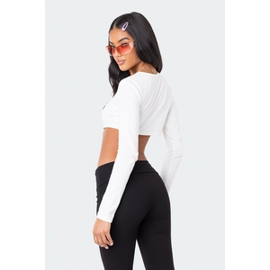 Side view of women's black low-waist flare yoga pants with slim fit athletic design