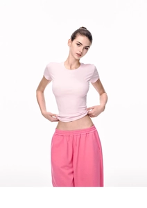 Detailed view of slim-fit pink ribbed short sleeve T-shirt with matching joggers