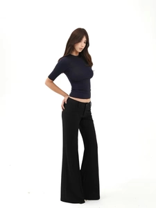 Slim fit navy blue short sleeve t-shirt paired with black high waist flare trousers