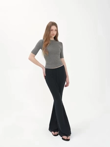Minimalist grey slim fit short sleeve T-shirt paired with black high waist flared pants