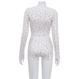 Detailed back view of two-piece floral loungewear set with white lace trim and pink patterns