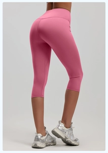 Rear view of pink high-waisted cropped yoga pants showing high-stretch fit and quality fabric