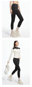 Detail of high waisted yoga pants with cropped zipper jacket and thumb hole sleeves