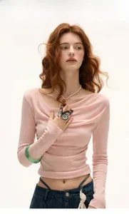 Close-up of pink long sleeve slim fit top featuring an elegant asymmetrical cowl neckline