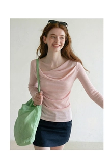 Close-up of the elegant draped cowl neckline on this pink long-sleeved knit top