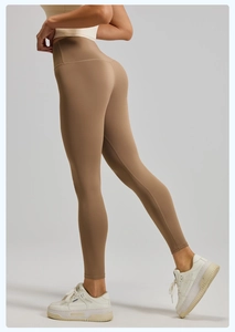 Detail of high-waist seamless khaki yoga leggings showing tummy control and lift effect