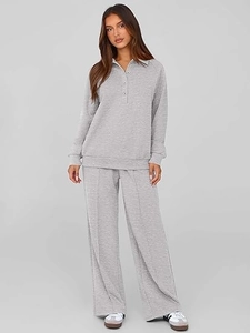 Detailed view of light gray knit lounge set featuring buttoned polo top and wide-leg trousers