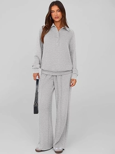 Detail of grey two-piece knit lounge set with long-sleeve polo top and wide-leg trousers