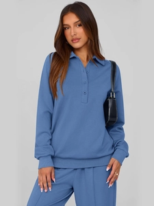 Detail view of Morandi blue long sleeve polo top and matching trousers knit set