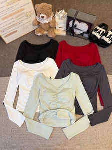 Detail view of ribbed long sleeve V-neck tees with ruched front in multiple colors