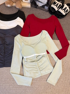 Detailed close-up of V-neck ruched long sleeve tops with built-in pads in multiple colors
