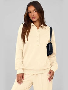 Detail of cream long sleeve polo knit top with ribbed cuffs and matching joggers set