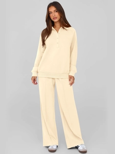 Detail of cream polo collar sweatshirt and matching wide-leg pants with center seam detail