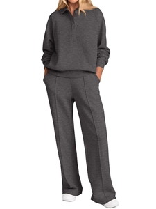 Detail of dark gray two-piece set featuring a polo neck top and wide leg pants