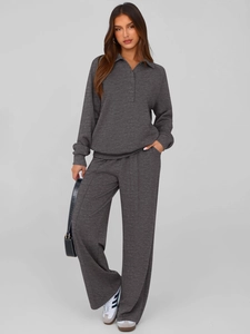 Close-up of charcoal grey polo top and wide-leg trousers set with premium knit texture