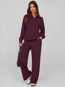 Detail view of burgundy long sleeve polo top and matching wide leg pants set for women