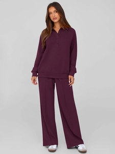 Detail of deep plum two-piece lounge set featuring polo neck top and wide leg pants