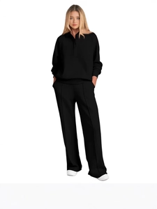 Women's black two-piece sports set featuring long sleeve polo sweatshirt and wide leg pants