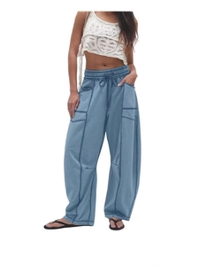 Women's light blue wide-leg casual pants with drawstring waist and cargo stitching details