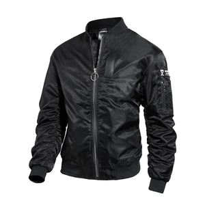 Close-up of black MA1 bomber jacket featuring functional sleeve pocket and zip details