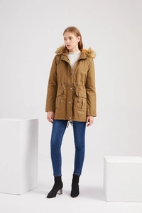 Women's khaki hooded parka with faux fur trim, waist drawstring, and large flap pockets
