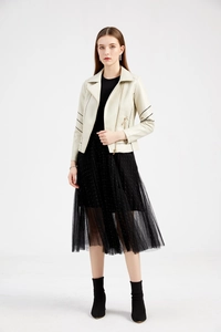 Detail of off-white faux leather biker jacket with black sleeve stripes and zipper features
