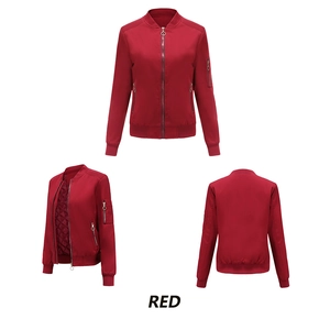 Detail view of red bomber jacket with metal ring zippers and quilted lining