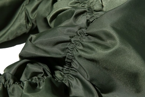 Detail of army green nylon fabric with premium shirring stitching on the bomber jacket sleeve
