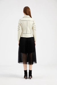 Back view of a beige PU leather biker jacket featuring bold black geometric line details