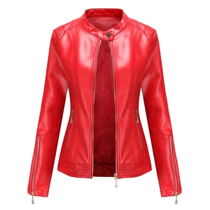 Detail view of red faux leather jacket with stand collar and gold zipper accents