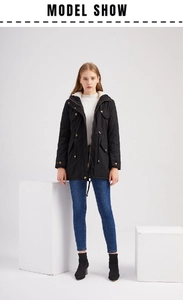 Detail of black winter parka featuring warm fleece lining and adjustable waist drawstring