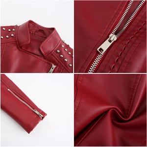 Detailed close-up of silver studs and high-quality metal zippers on burgundy faux leather jacket