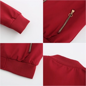 Detailed views of red bomber jacket featuring ribbed cuffs and gold metal zipper pocket