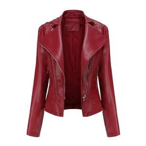 Detail of burgundy faux leather biker jacket featuring metallic rivets and silver zippers