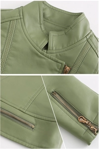 Detail of green faux leather jacket with quilted shoulders and rhinestone zipper sliders