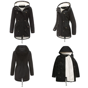 Detail view of black parka coat showing plush lining, drawstring waist and golden buttons