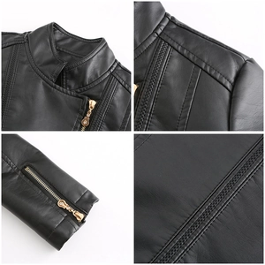 Detail of black faux leather jacket featuring gold zippers and classic stand collar design