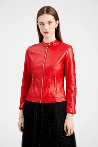 Close-up of a red leather jacket featuring a stand collar and gold metal zippers