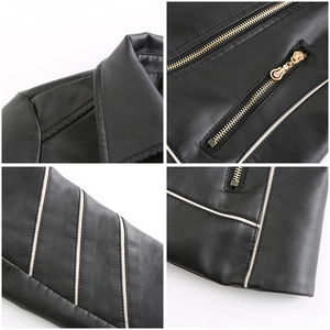 Detail of black PU jacket showing lapel stitching, gold zipper and white sleeve stripes