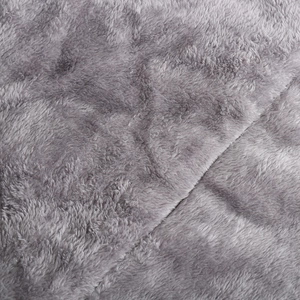 Detailed close-up of grey faux fur lining and quality stitching on the winter parka coat