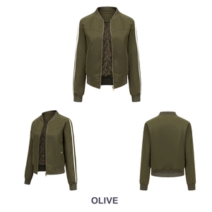 Detail of olive bomber jacket with white sleeve stripes and quilted diamond lining