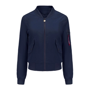 Detail of navy bomber jacket featuring a red Apple Smile ribbon on the sleeve pocket